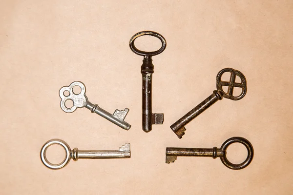 A lot vintage keys from the locks on craft paper