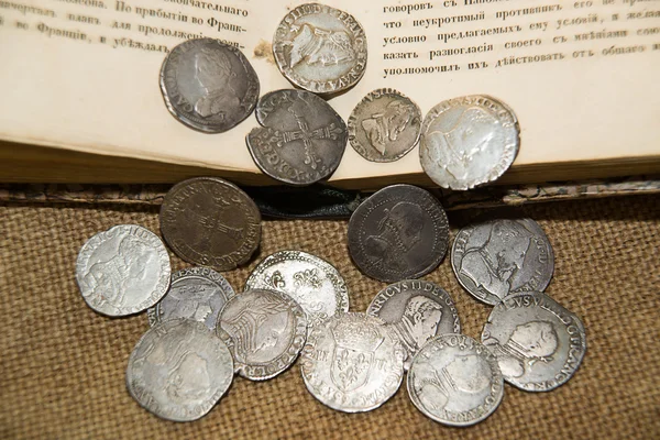 Ancient French silver coins with portraits of kings on the old c