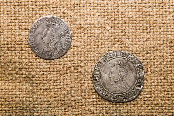 Ancient England silver coins with portraits of kings on the old