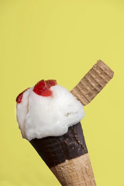 Lemon ice cream with strawberry pieces