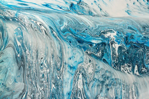 Blue marbling texture. Creative background with abstract oil painted waves, handmade surface. Liquid paint.