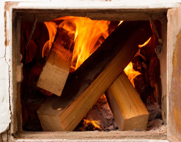 Open door, rustic stoves, burning wood and fire. heating homes a