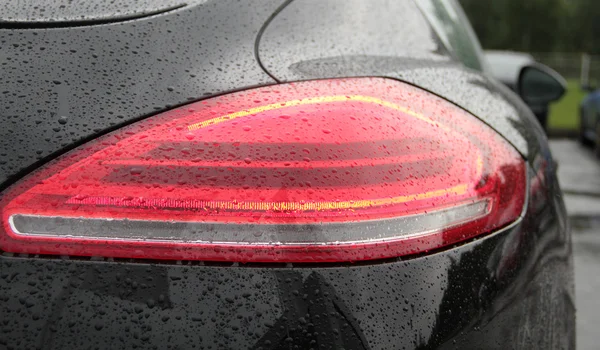 Water drops on car backlights after rain protection coating