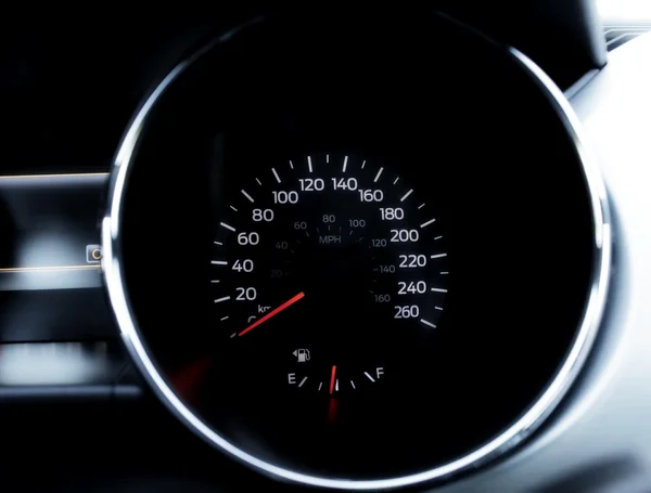 Speedometer on the dashboard of sport car closeup
