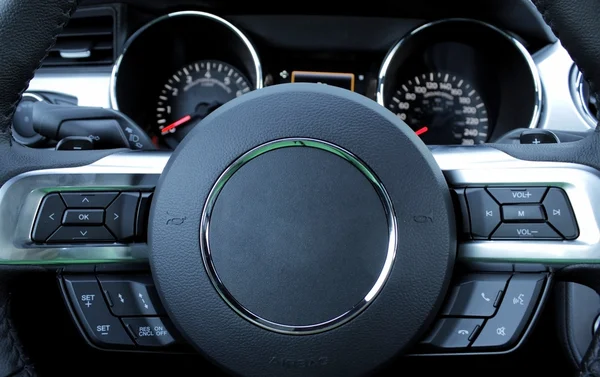 Dashboard and multifunction steering wheel inside the car detailed