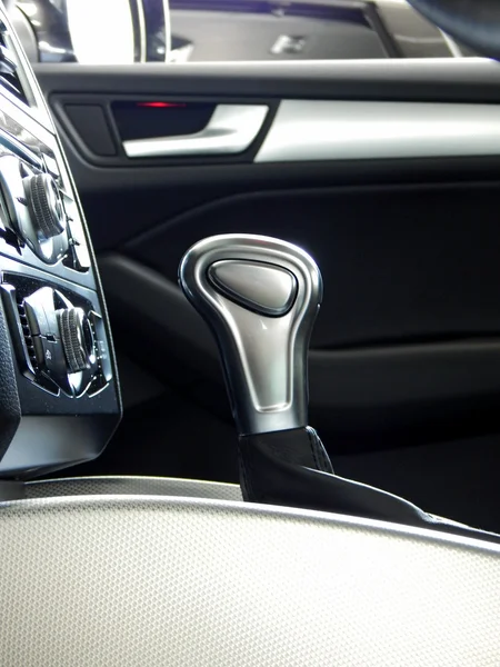 Car parts and interior accessories. Gear shift knob in premium class car