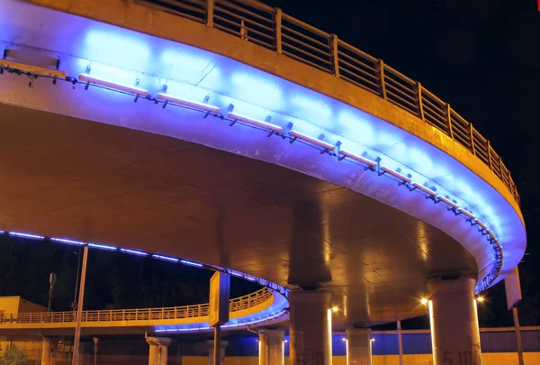 Street lighting and illumination on the bridge and road at night