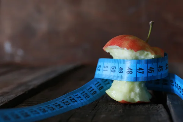 Measurement red bitten apple