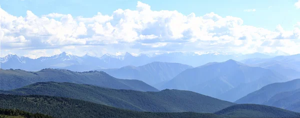 Mountains in the blue haze. evening. summer landscape. panorama