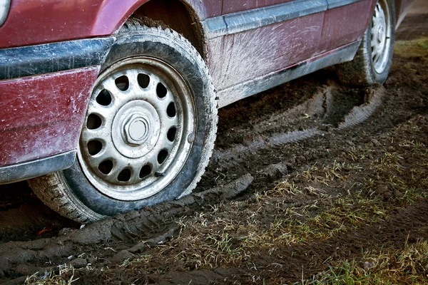 Car tires in dirt