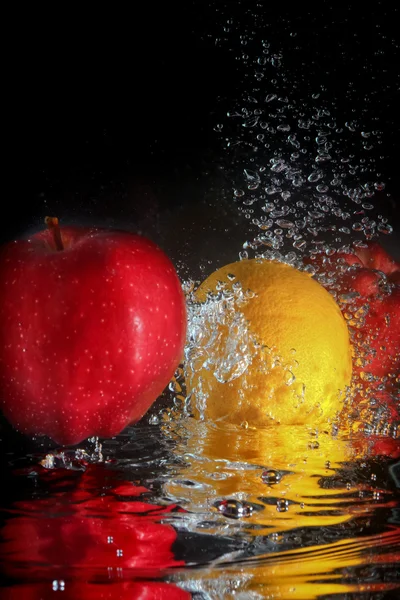 Splashing fruit on water.