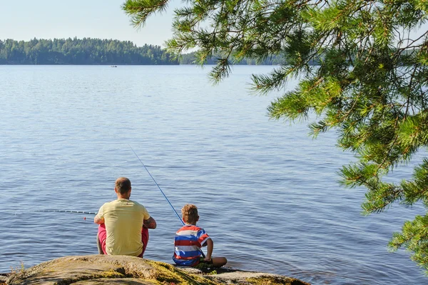 Dad and son lake fishing