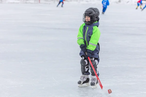 KOROLEV, RUSSIA - MARCH 8, 2016: Young boy during ice hockey training at open air Vympel stadium