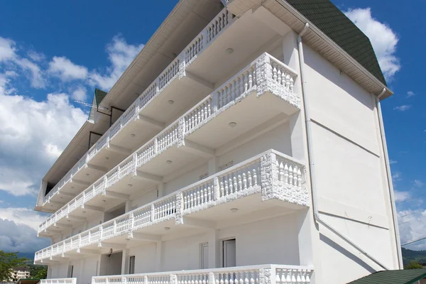 White apartment house with balconies