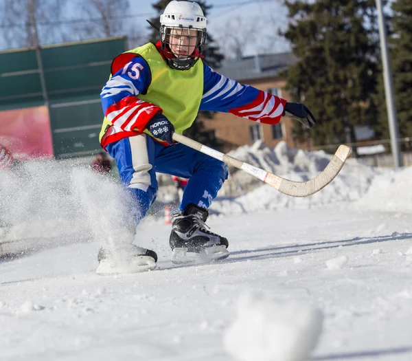 RUSSIA, OBUKHOVO - JANUARY 10, 2015: 2-nd stage childrens hockey League bandy, Russia. Players warmig-up  before the game.