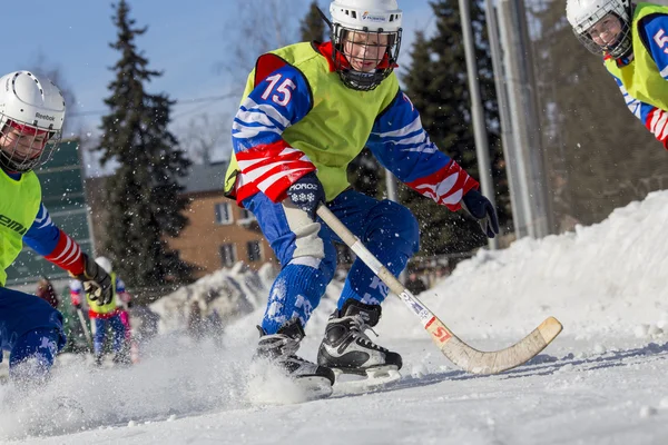 RUSSIA, OBUKHOVO - JANUARY 10, 2015: 2-nd stage childrens hockey League bandy, Russia. Players warmig-up  before the game.