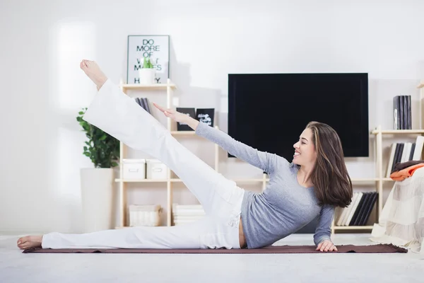 Woman is doing fitness at home