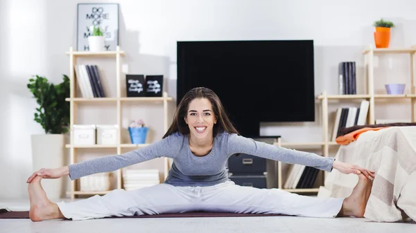 Woman is doing fitness at home
