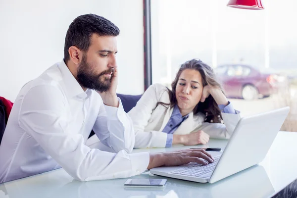 Businessman and businesswoman In Coffee Shop