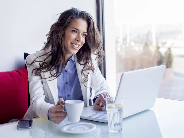 Businesswoman working on laptop