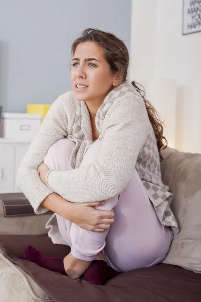 Woman with hard stomach pain