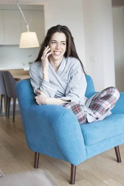 Woman in living room with cell phone