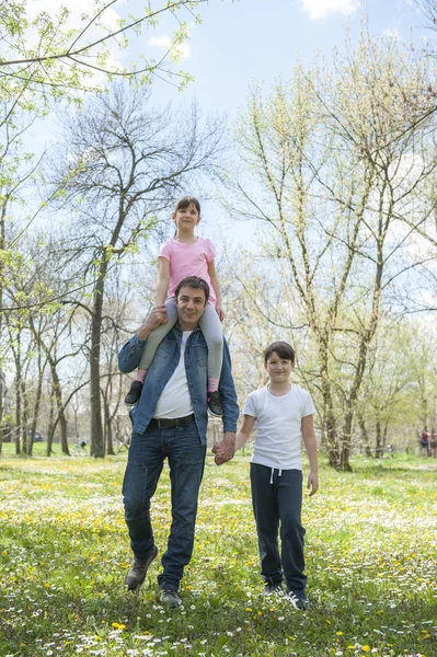 Father with children in park