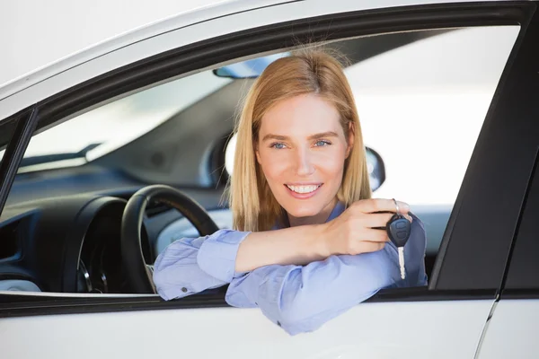 Woman in car holding car key