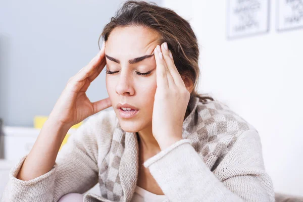 Woman with hard headache