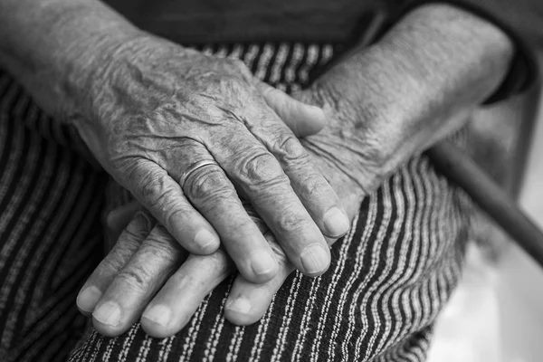 Close-up of old womans hands, black and white