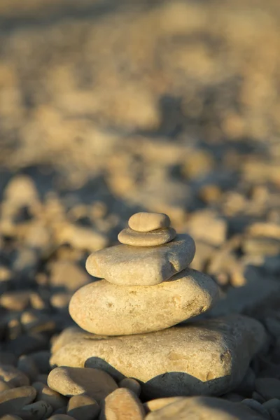 Stones and rocks balance on the beach