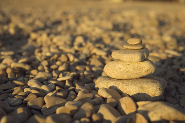 Stones and rocks balance on the beach