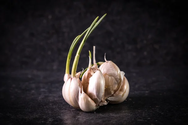 Garlic bulbs with garlic cloves on wooden table,soft focus