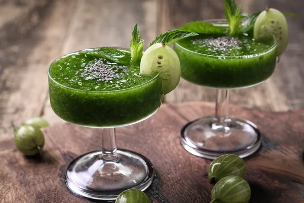 Healthy green fresh fruit and vegetable juice smoothie breackfast