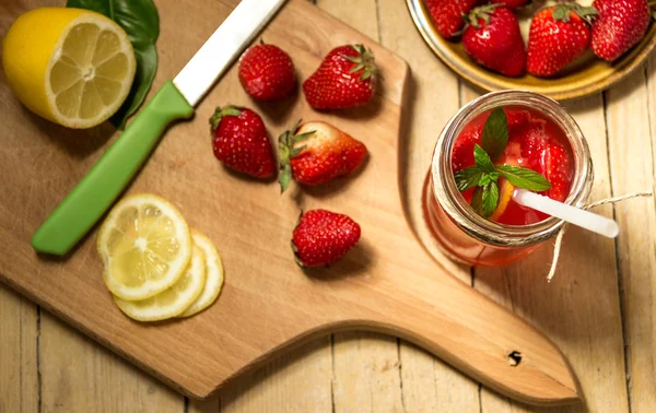 Glass of freshness lemonade with strawberries and mint. Healthy eating