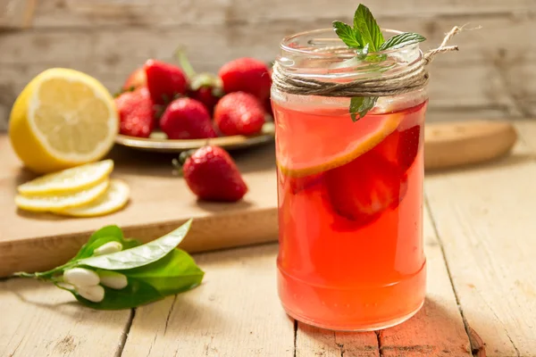 Glass of freshness lemonade with strawberries and mint. Healthy eating