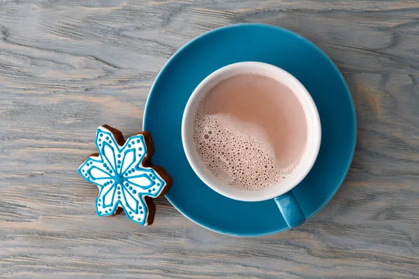 Cocoa cup with gingerbread snowflake candy