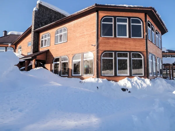 Winter view recreation center with large snow drifts