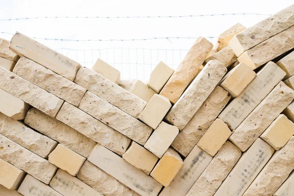 Facing bricks stacked in a warehouse building base