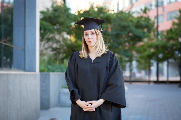 Portrait of female college student on campus in graduation day