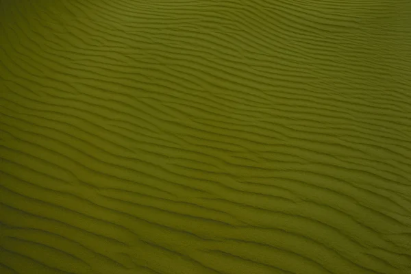Perfect texture dark  green waves of sand. background for deskto