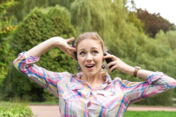 Beautiful girl talking on the phone a lot