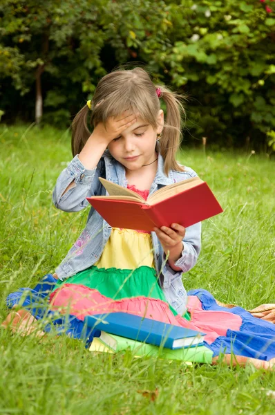 Girl prepare lessons on the nature and tired