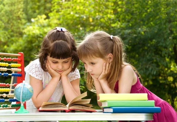 Girls prepare lessons on the nature and tired