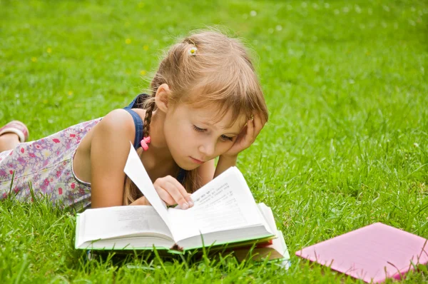 Girl prepare lessons on the nature and tired