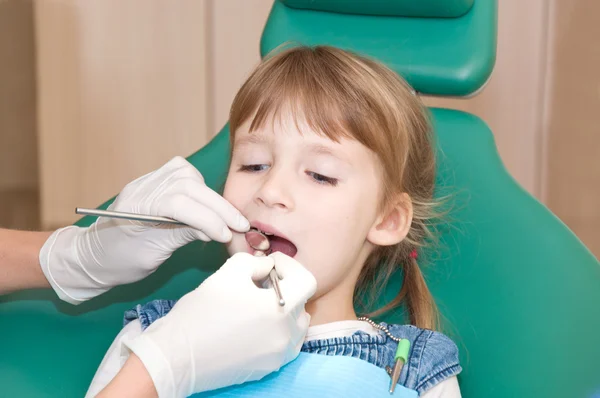 Little girl on reception at the dentist