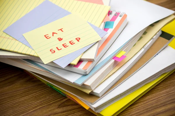 Eat and Sleep; The Pile of Business Documents on the Desk