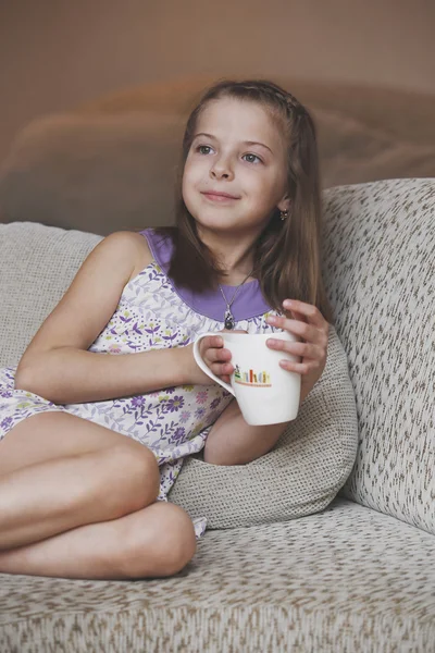 The girl child with a mug