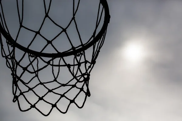 Silhouette of basketball hoop