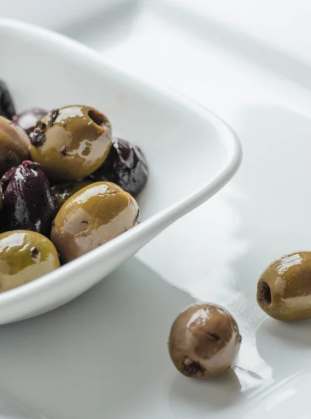 Mixed olives in white bowl